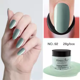 dip powder nails, green nails, applying dip powder to nail