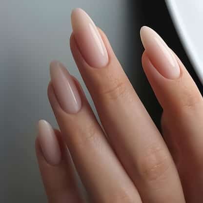 Acrylic Nails light pink nail polish closeup