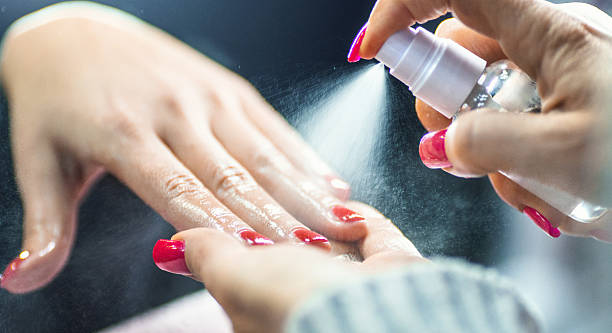 nail-top-coat-spray-on-red-nail-polish