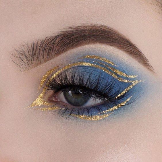 light blue eyeshadow makeup with glitter gold liner