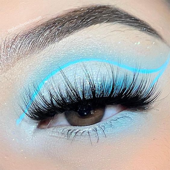 light blue snowy shiny eyes with long light blue curve liner and long lashes