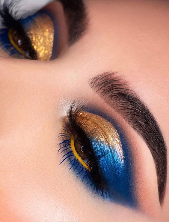 shimmer gold and blue eye makeup with beautiful lashes