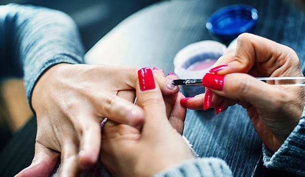 gel manicure nail treatment applying with brush