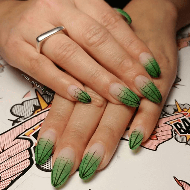 Matte acrylic halloween nails with green spider web tips